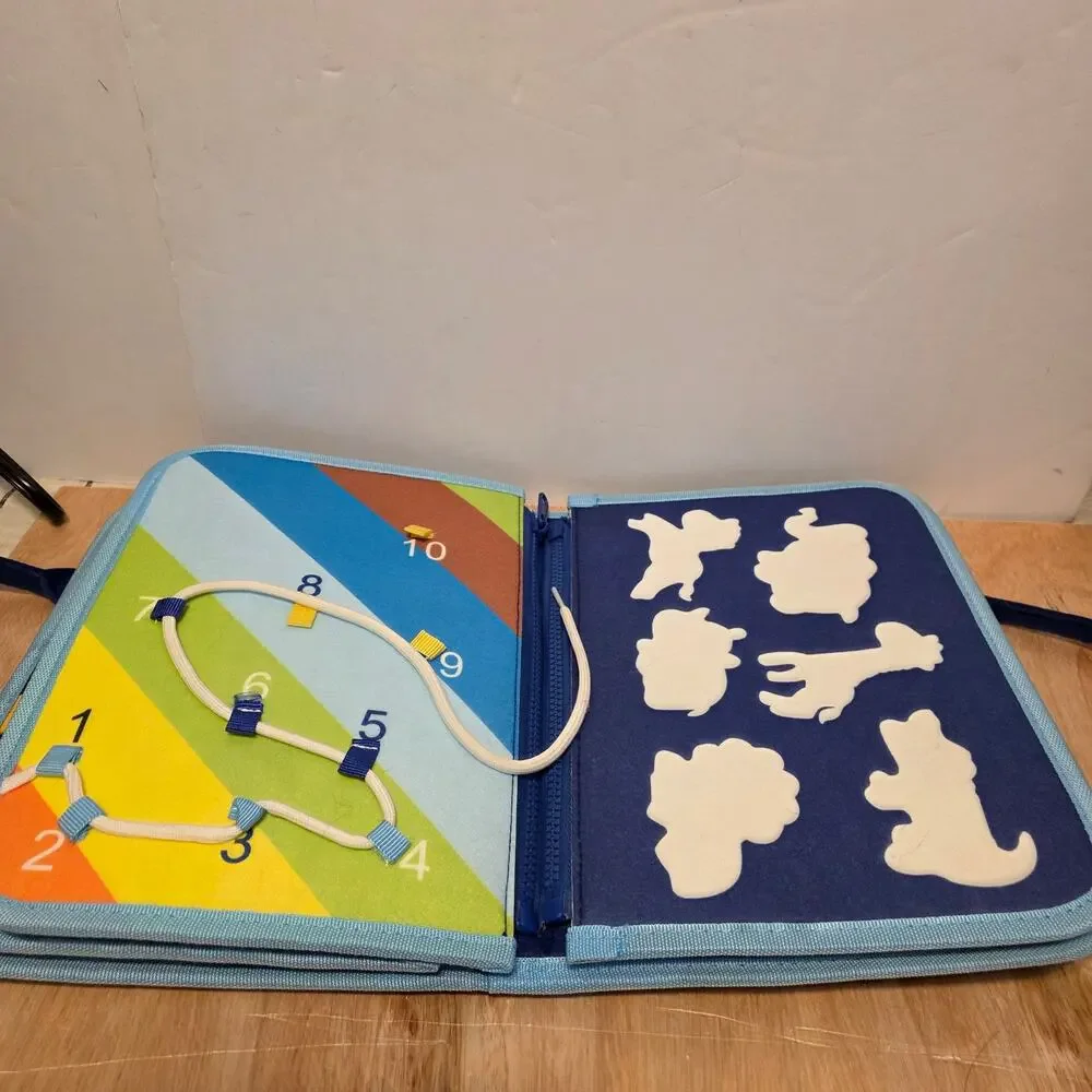 Esjay Toddler Busy Board in a portable dinosaur-themed felt carry case
